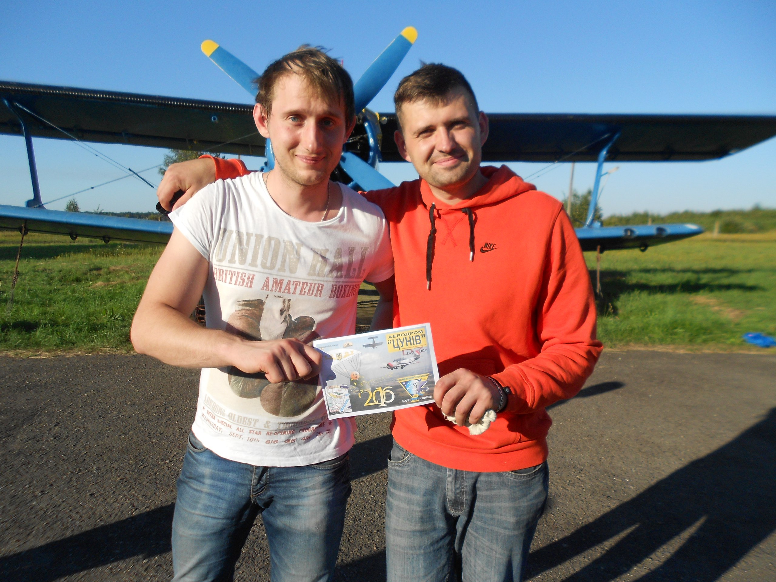 Agiliway engineers presenting their certificate of Parachute jump completion